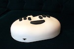 White portable Braille printer with black buttons